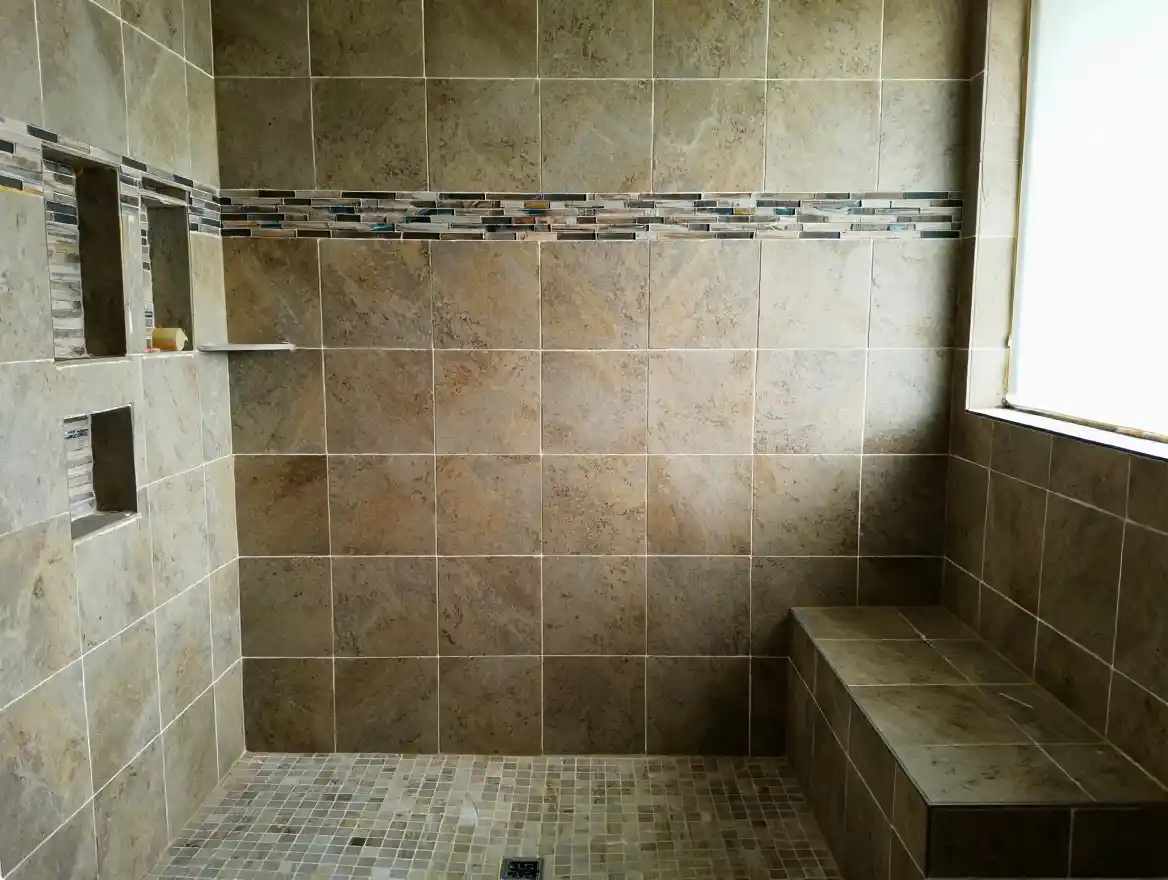 Custom tile shower with accent stripe showing Stockton Swift Fix handyman tile shower installation services in Stockton CA with waterproof bench and niches